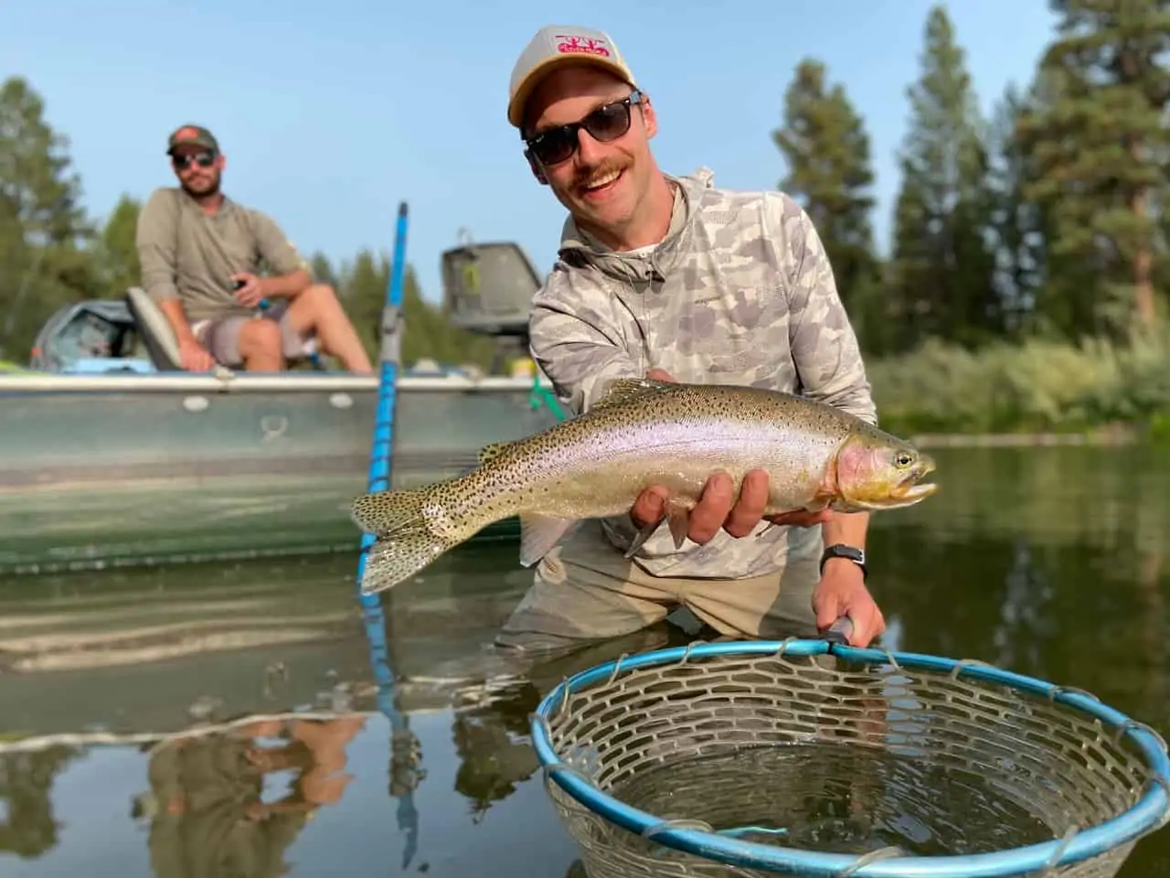Man holding fish over net
