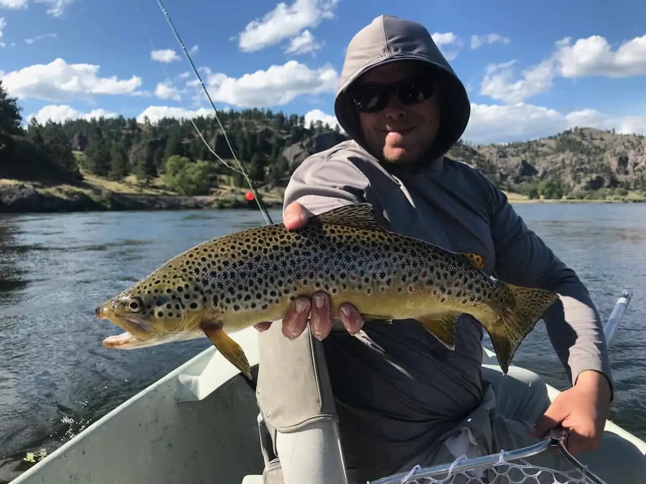 Man holding fish with black spots missouri river